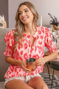 Leopard print BiBi smocked short sleeve blouse from Trendsi, featuring a trendy, fitted design with a stylish neckline.