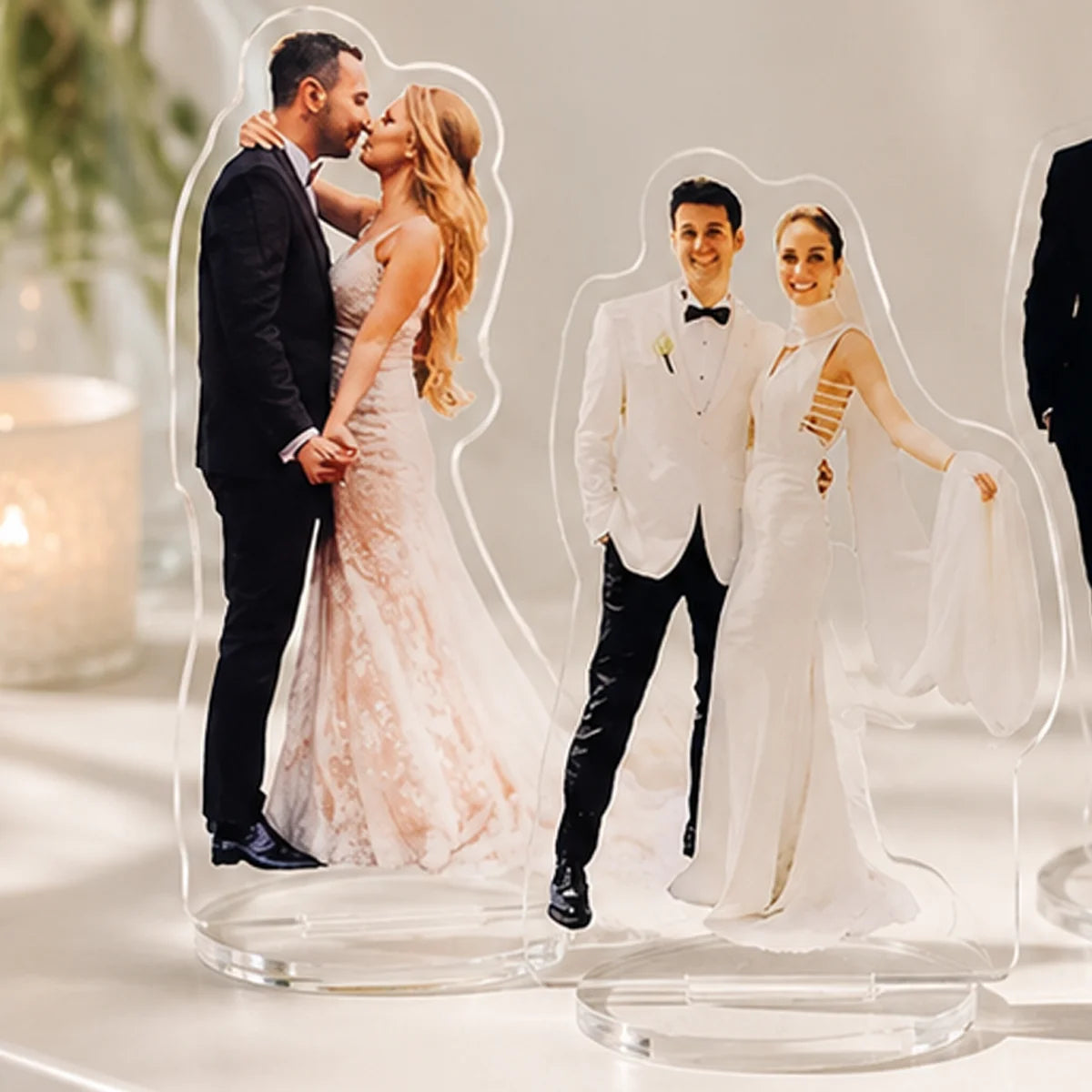 Veltora set of 1/2/5 personalized acrylic wedding human character standees on a desktop display.