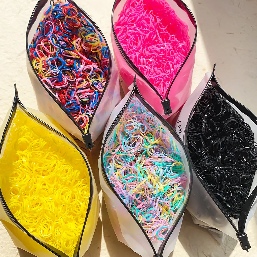 Colorful disposable rubber band hair ties and ponytail holders for girls, children’s hair accessories by Veltora, in multiple sizes.