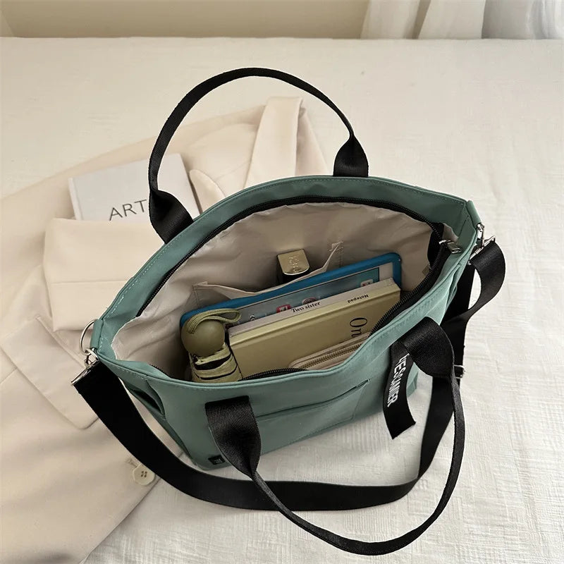 Veltora waterproof nylon tote bag for women, large capacity lightweight crossbody bag suitable for work, travel, or gym use.