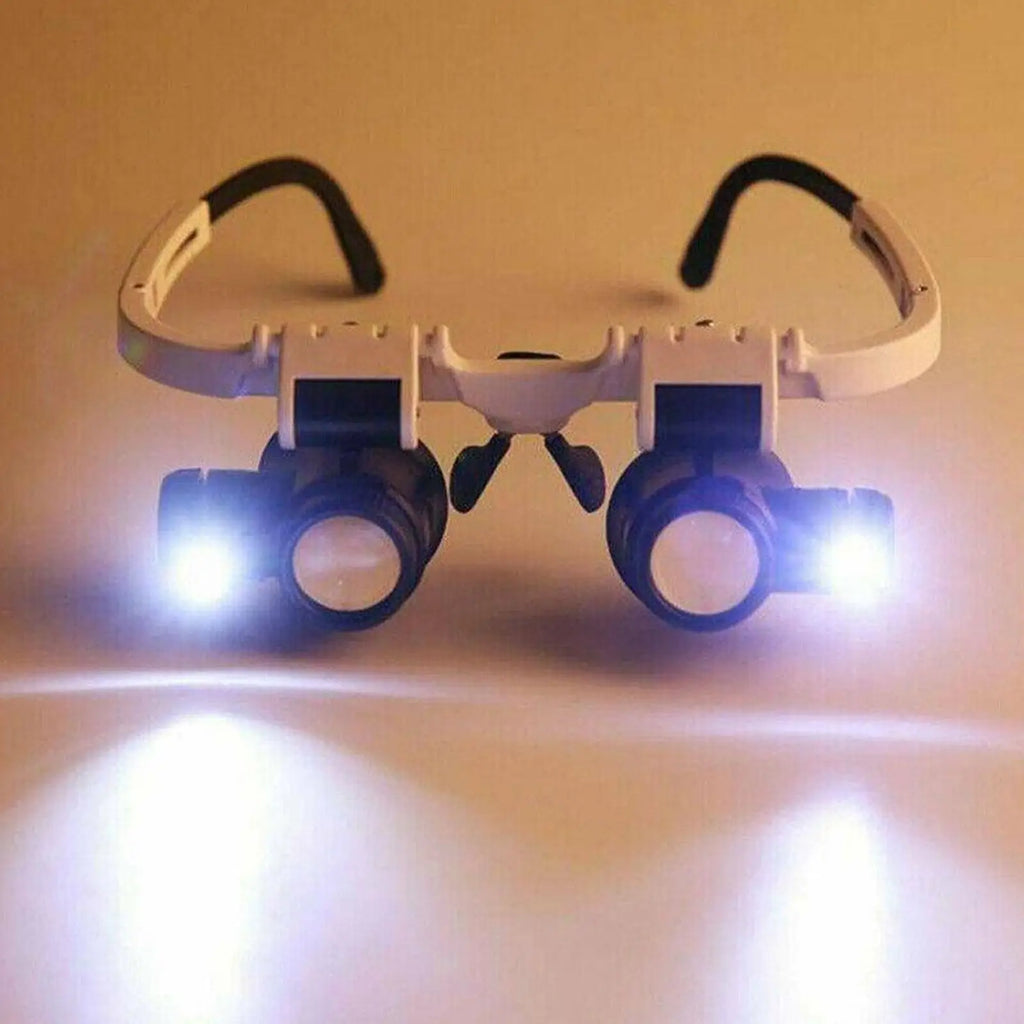 Veltora LED jeweler repair magnifier headband with adjustable eye glasses, featuring 8X, 15X, and 23X loupe lenses for detailed work.