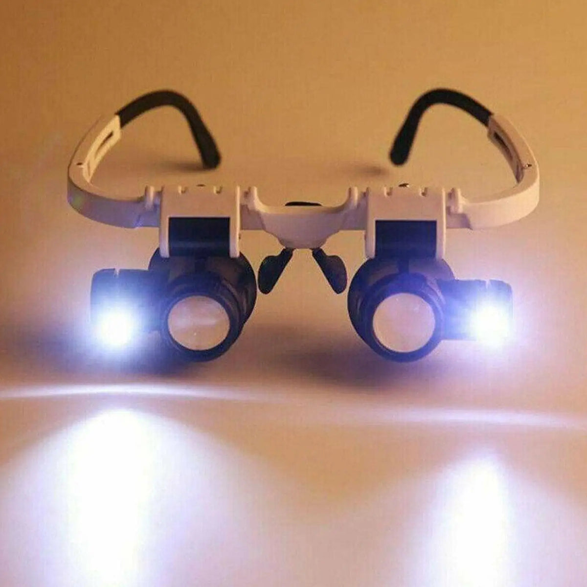 Veltora LED jeweler repair magnifier headband with adjustable eye glasses, featuring 8X, 15X, and 23X loupe lenses for detailed work.
