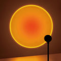 Veltora Sunset Projection Lamp with rotatable design, USB-powered home decor lamp for living room or bedroom ambiance.