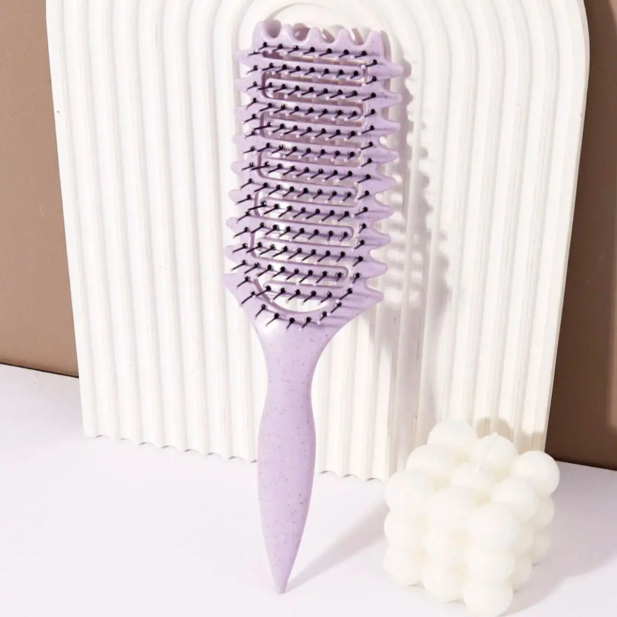 Veltora curling styling brush with hollow massage comb, nylon mane, and ABS plastic handle for comfortable grip on real hair wigs.