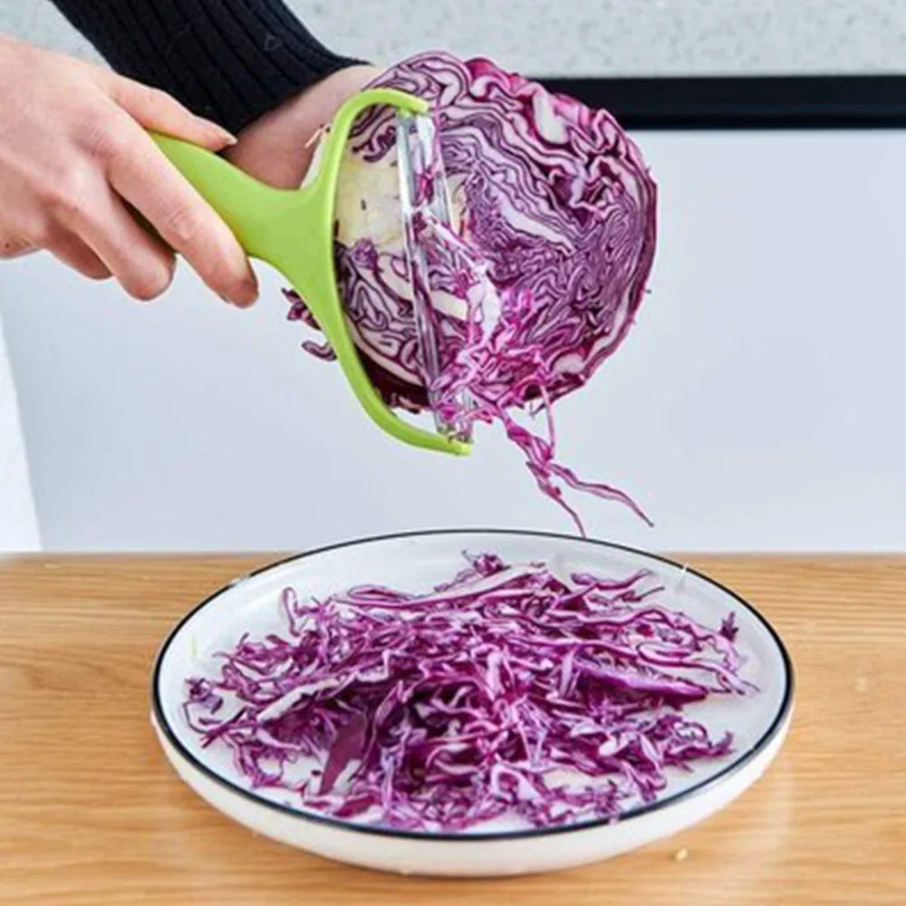 Veltora cabbage slicer and vegetable cutter with stainless steel blades for shredding cabbage, carrots, cucumbers, and potatoes in the kitchen.