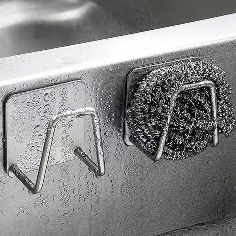 Stainless steel sink sponge rack by Veltora with wire ball holder, ideal for draining sponges and cleaning supplies in the kitchen.