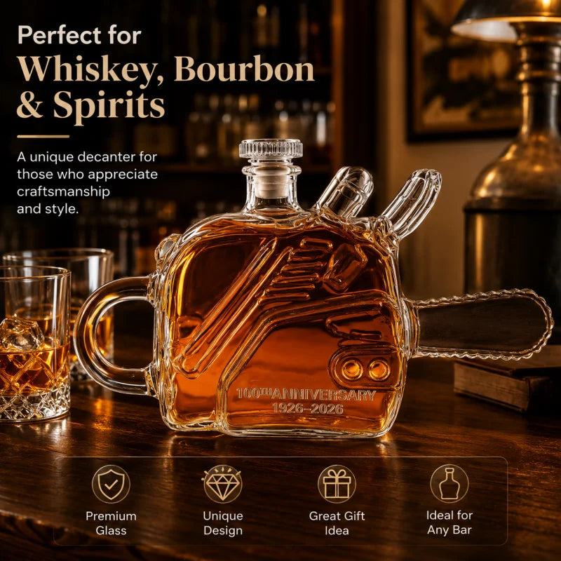 Veltora chainsaw-shaped glass whiskey decanter commemorating 100th anniversary, industrial-style liquor bottle and spirits carafe.