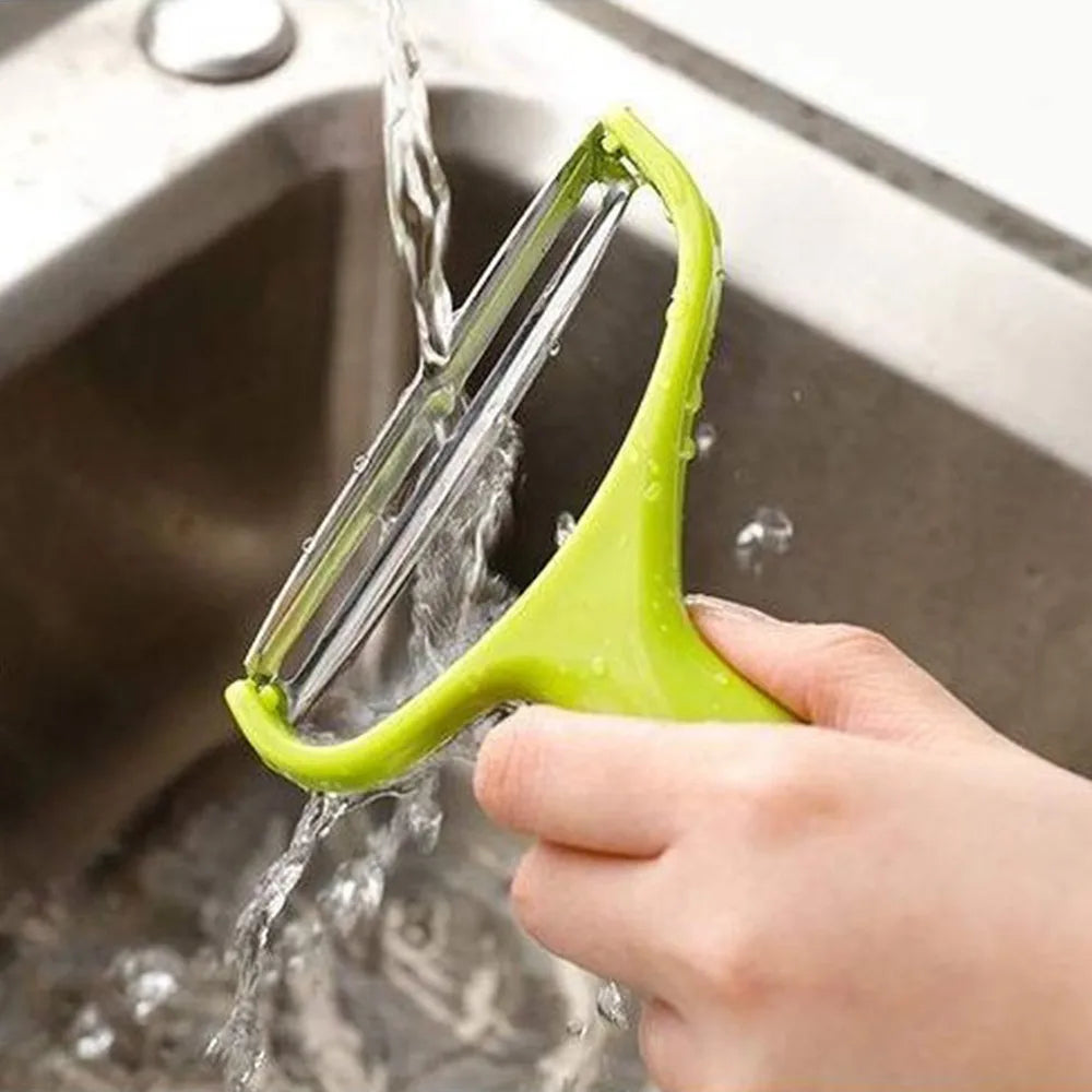 Veltora cabbage slicer and vegetable grater with stainless steel blades for salads, potatoes, carrots, and cucumbers in a home kitchen setting.