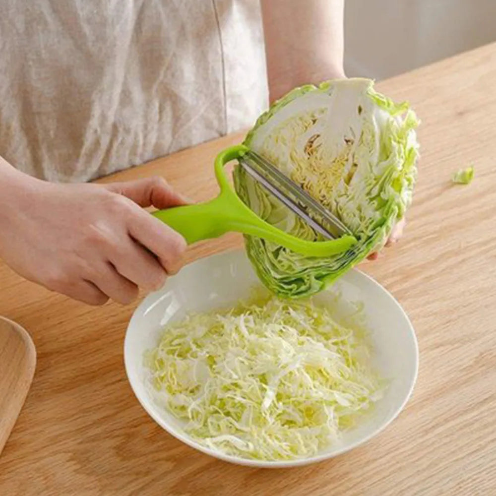 Veltora cabbage slicer and vegetable grater with stainless steel blades for shredding cabbage, carrots, cucumbers, and potatoes.