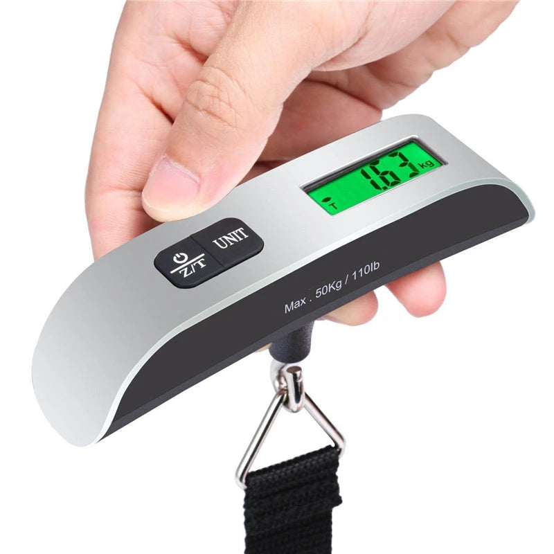 Veltora portable digital luggage scale with LCD display, showing weight of a suitcase for travel and baggage weighing.