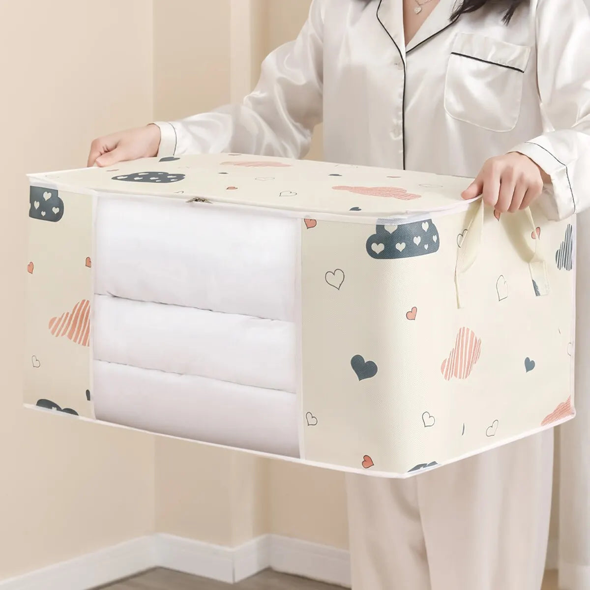 Veltora large capacity clothes storage bag with reinforced handle, sturdy zipper, folds for blankets and bedding organization.