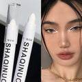 Veltora matte eyeshadow stick and white eyeliner with shimmer silver highlighter pen, displayed with the product tip visible.
