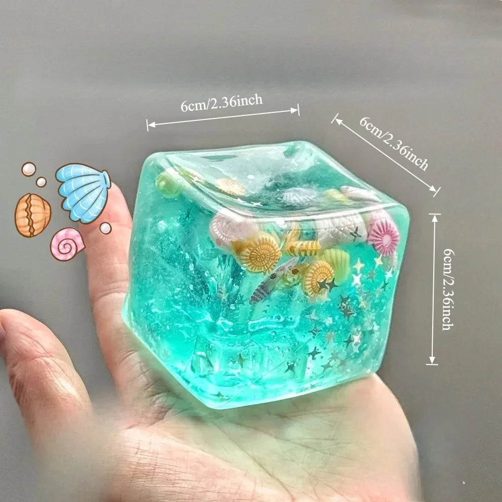 Veltora Taba Squishy Stress Ball cube featuring ocean design, slow rise fidget toy for kids and adults to squeeze and relax.