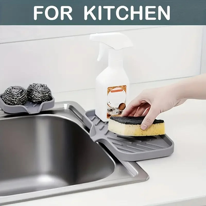 Veltora silicone faucet mat and sink tray with soap dispenser, sponge drain pad, and countertop drying storage for kitchen sink area.