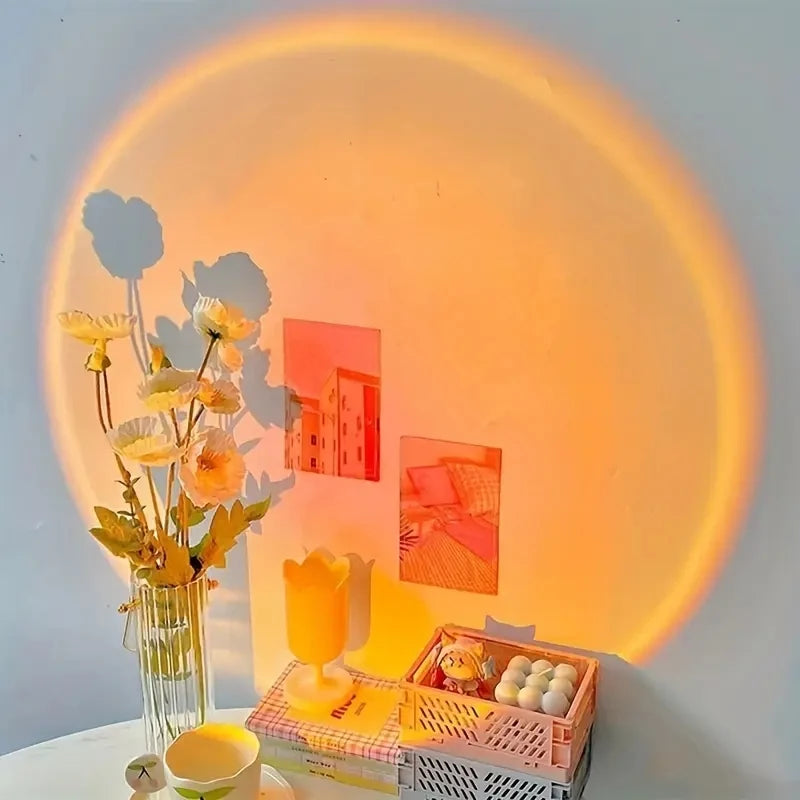 Veltora Sunset Projection Lamp showing warm sunset scene, USB-powered, multi-angle rotatable home decoration for living room or bedroom