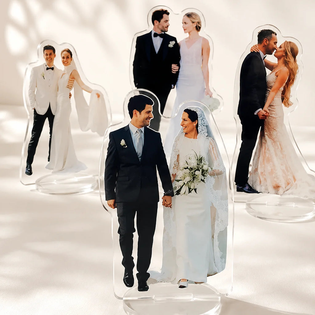 Set of 1, 2, or 5 customizable acrylic wedding human standee figures by Veltora, featuring personalized photo characters on desktop displays.