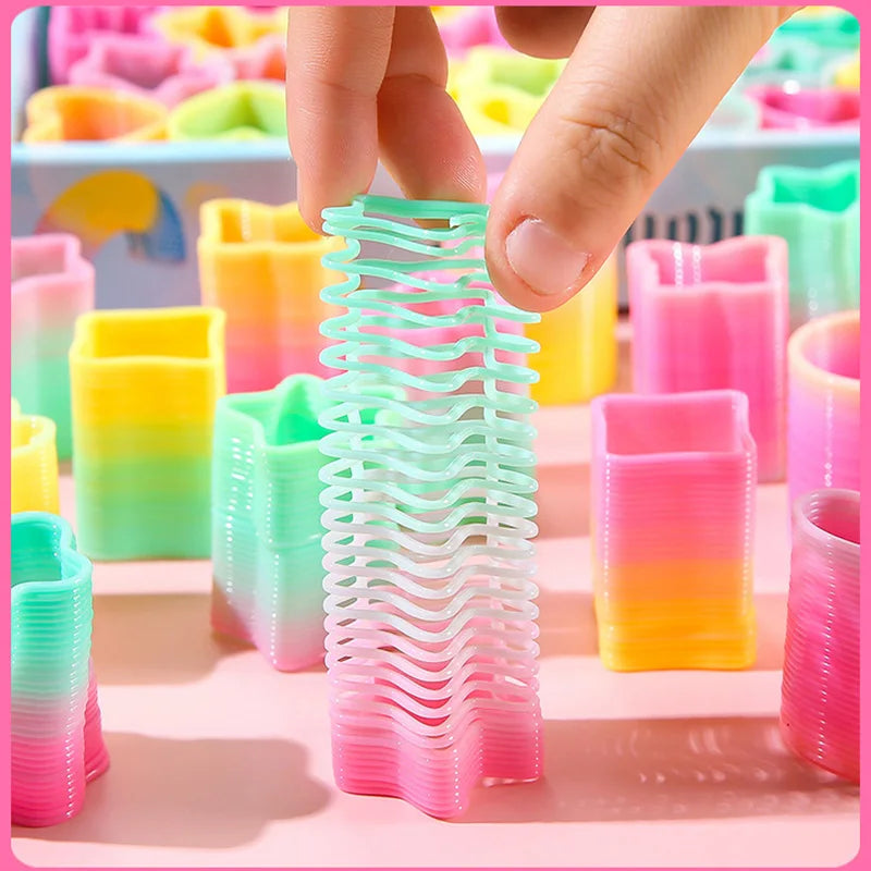 Colorful Rainbow Magic Springs Circle Toy by Veltora, flexible fun toy for kids, ideal as birthday party favor or gift.