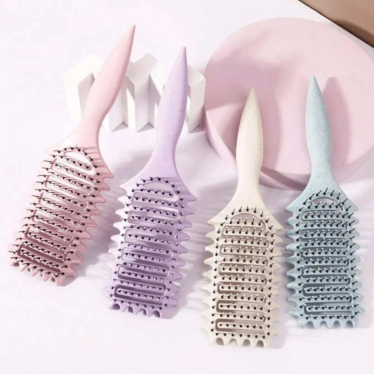 Veltora curling styling brush with hollow massage comb, nylon mane, and ABS plastic handle for real hair wigs.