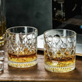 Set of two Veltora 330ml glass whiskey cups with relief design, suitable for cocktails, iced coffee, beer, and water.