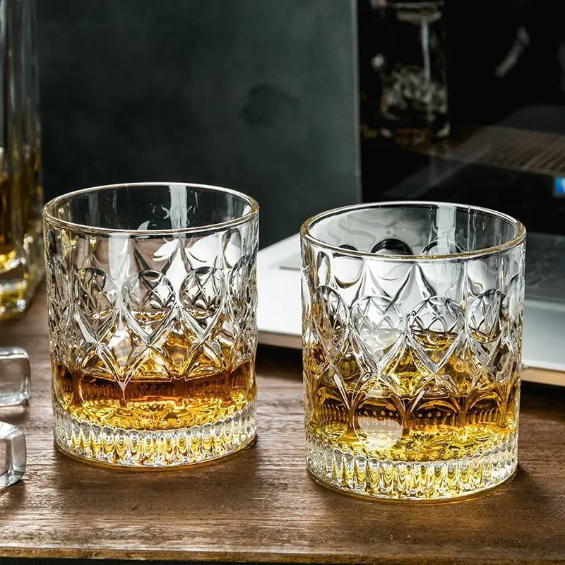 Set of two Veltora 330ml glass whiskey cups with relief design, suitable for cocktails, iced coffee, beer, and water.