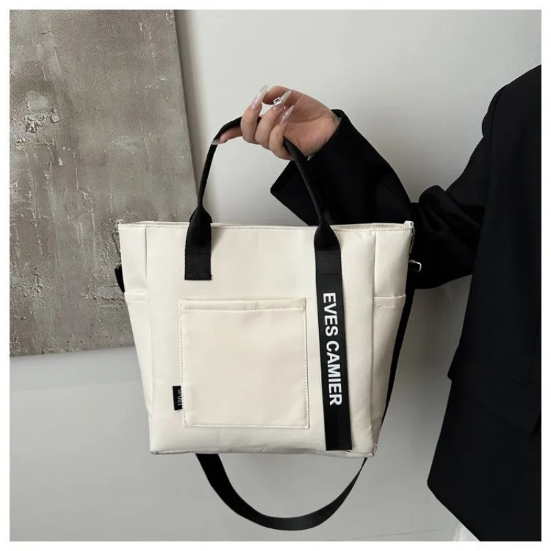 Veltora women's waterproof nylon tote bag with large capacity, lightweight crossbody design for students, work, travel, and gym.