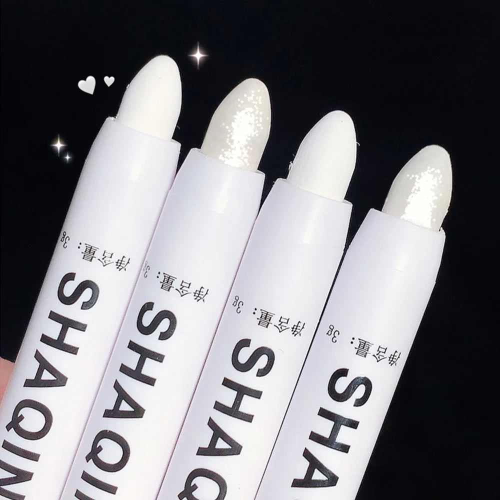 Veltora matte eyeshadow stick with white eyeliner and shimmer silver highlighter pen, featuring a sleek applicator and metallic finish