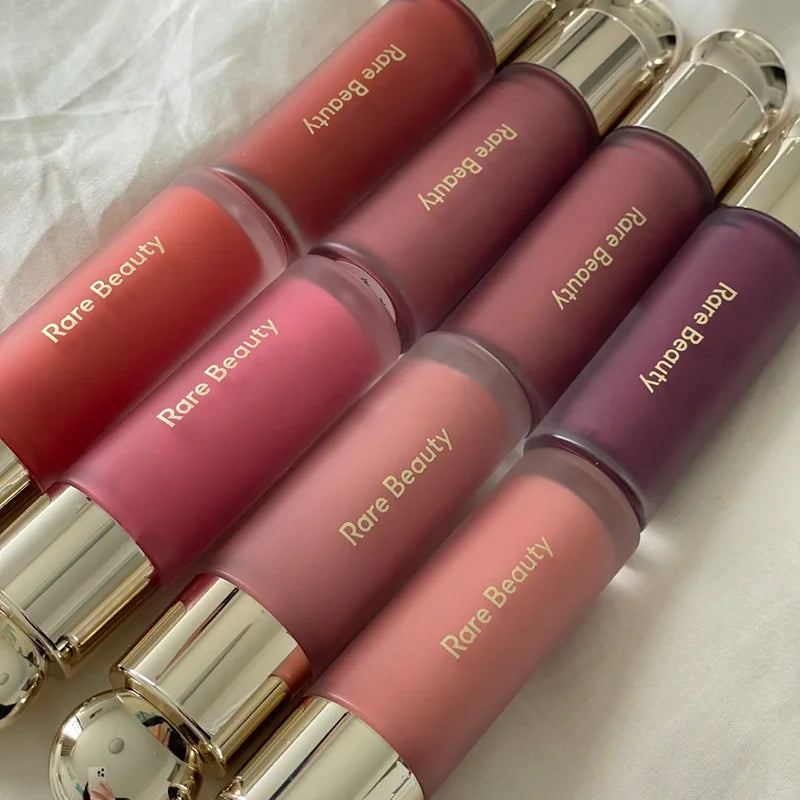 Veltora Rare Beauty Soft Pinch Liquid Blush in a silky, long-lasting pink shade applied to cheeks for a natural, radiant look.