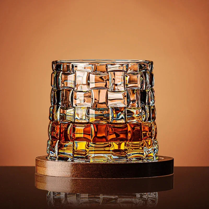 Veltora crystal whiskey tumbler with rotating base, spinning wine and brandy glass for bar or home drinkware.