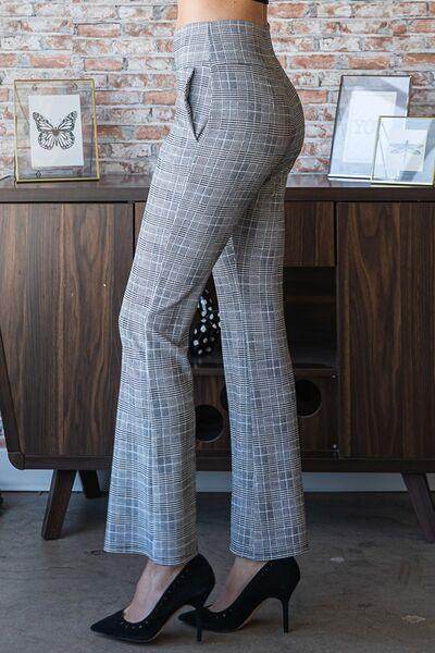 Heimish full size plaid flare pants with wide waistband, stylish plus-size fashion, shown in a natural pose.