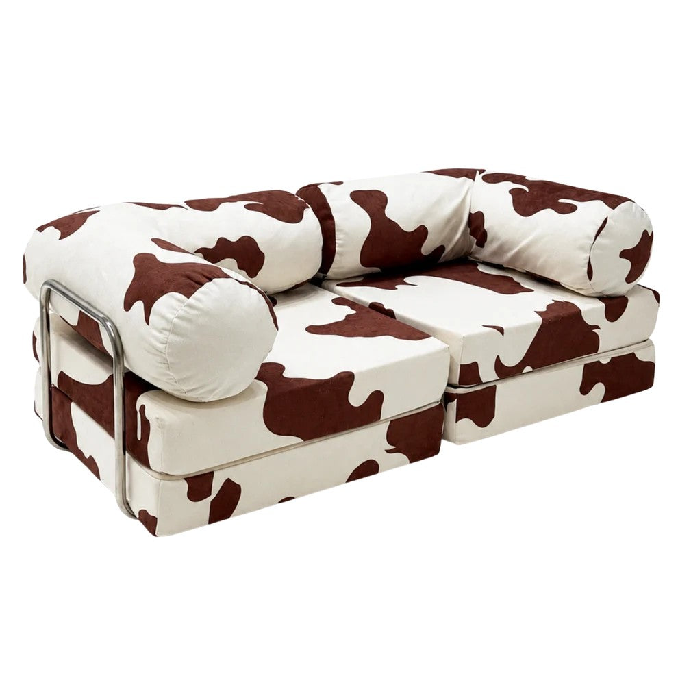 Bees&blooms HoneyHug soft modular children's sofa in cow print, featuring plush cushions and flexible design for kids' comfort.