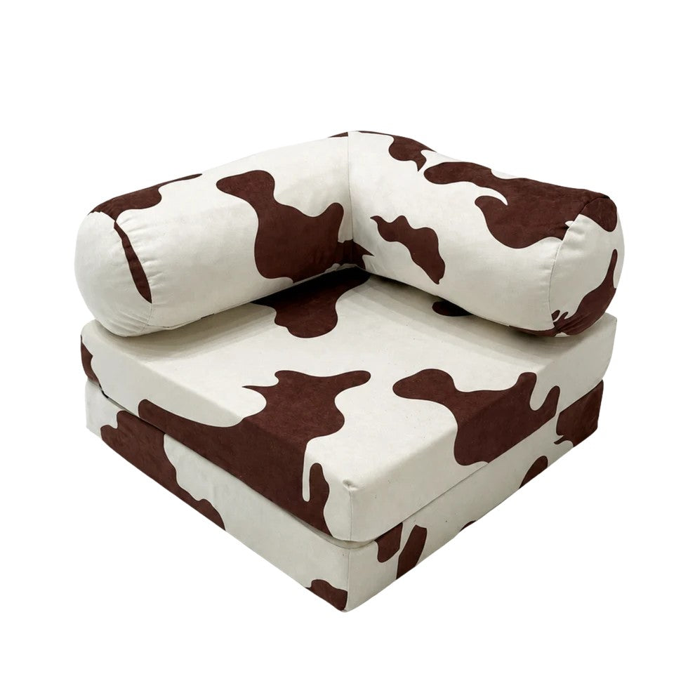 Bees&blooms HoneyHug soft modular children's sofa in cow print, featuring plush fabric, perfect for cozy play and relaxation.