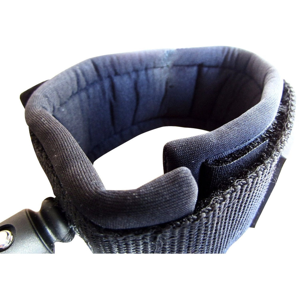 DORSAL surf leash for longboard and SUP, black polyurethane leg rope attached to a surfboard for secure riding.