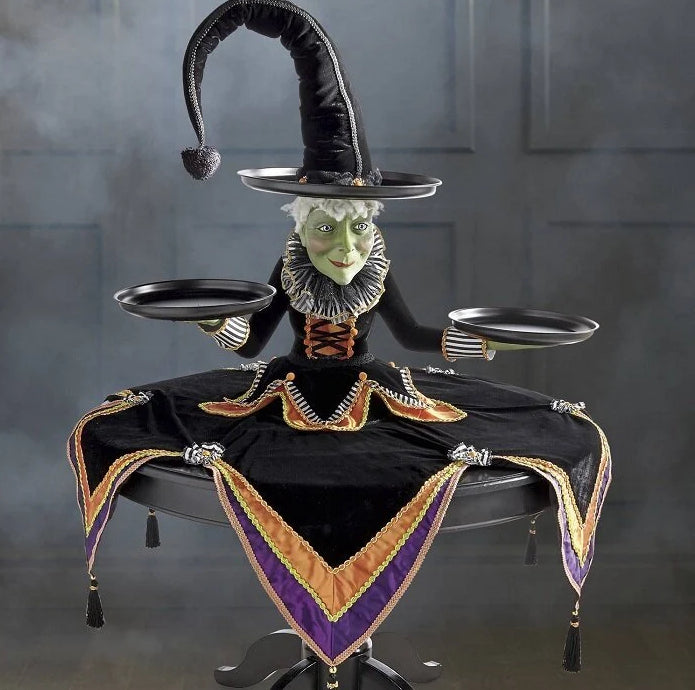 Resin witch display stand tray for Halloween decoration, featuring a black witch figure on a decorative craft ornament.