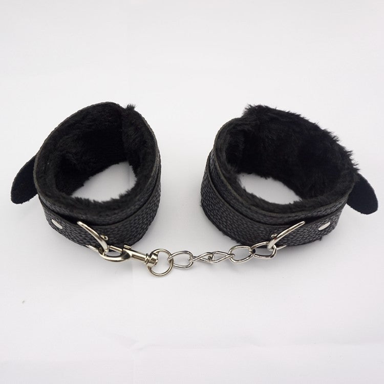 Black plush cross-lock handcuffs and ankle cuffs for adult play, made by Dropshipman, shown in a close-up image.