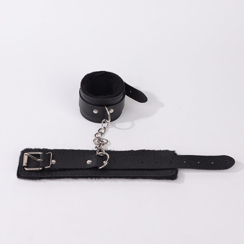 Black litchi-pattern handcuffs from Dropshipman, designed as couple punishment toys for intimate, highly suggestive play.
