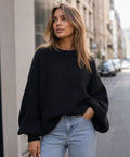 Black Dropshipman sweater with a classic crew neck and long sleeves, shown on a plain background.