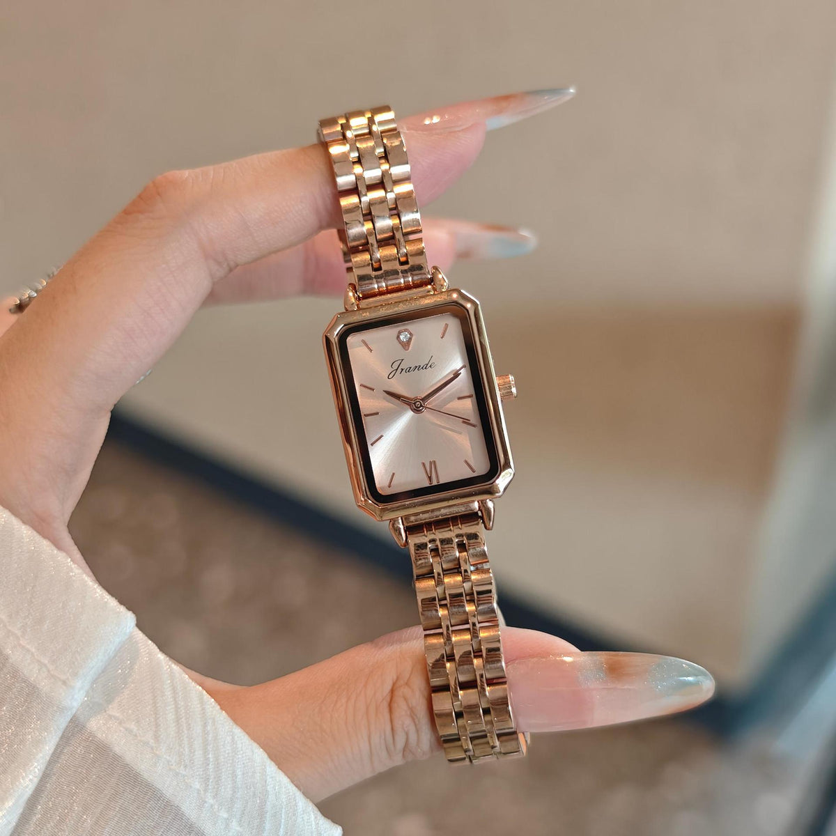 Women's French-style fashion quartz dress watch by Dropshipman with a rose-colored dial and elegant design.