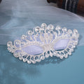 Silver Western-style masquerade mask with rhinestone embellishments, tassel veil, and ornate headdress for party or costume.