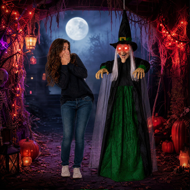 Life size purple talking witch decoration with glowing eyes, animatronic and voice-controlled, perfect for Halloween outdoor spooky decor.