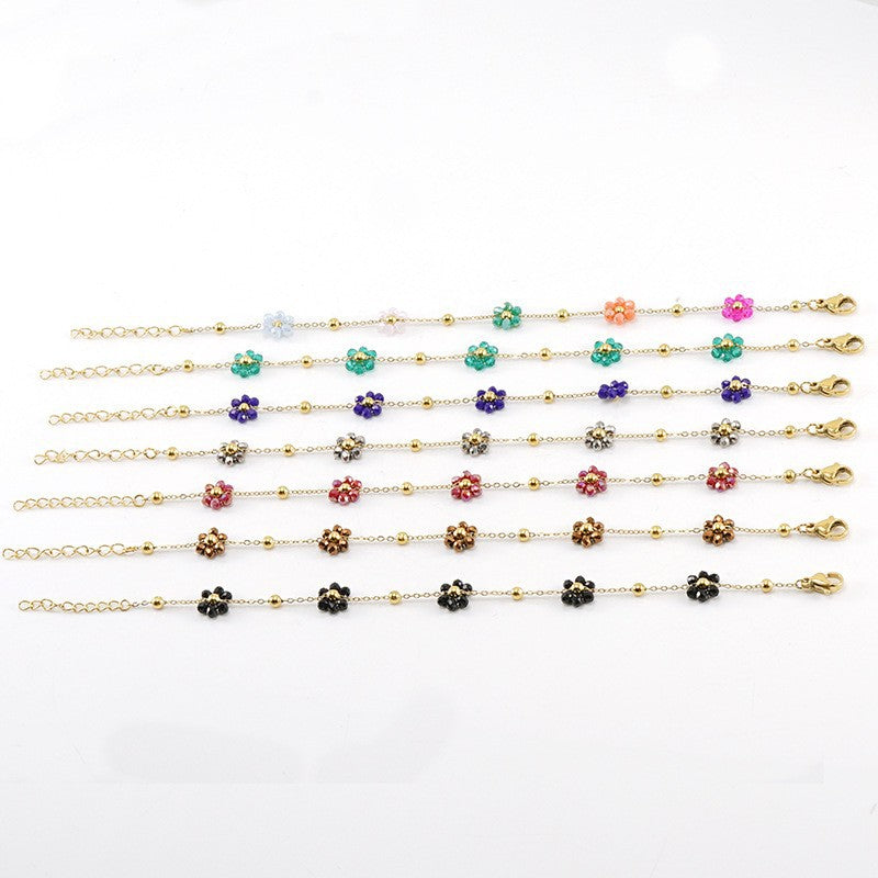 Versatile floral stainless steel bracelet and titanium steel necklace jewelry for women, featuring black metal accents and unique design.