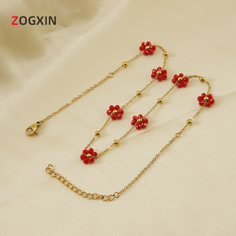 Versatile floral stainless steel bracelet and titanium steel necklace jewelry for women, featuring fresh floral design and sleek black finish.