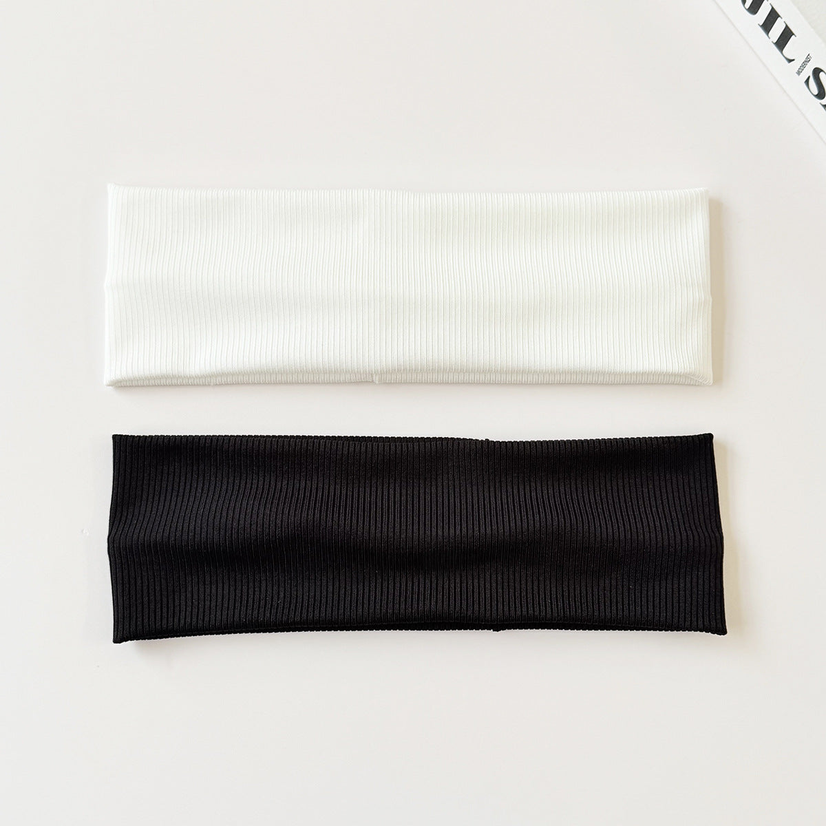 Black cotton elastic headband by eprolo, wide and sweat-absorbent, versatile solid color headwear for active or casual use.