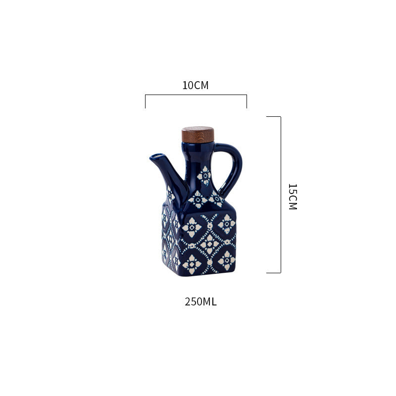 Blue ceramic oil and vinegar cruet set with cork stoppers, kitchen seasoning bottles by eprolo for storing oils and vinegars.