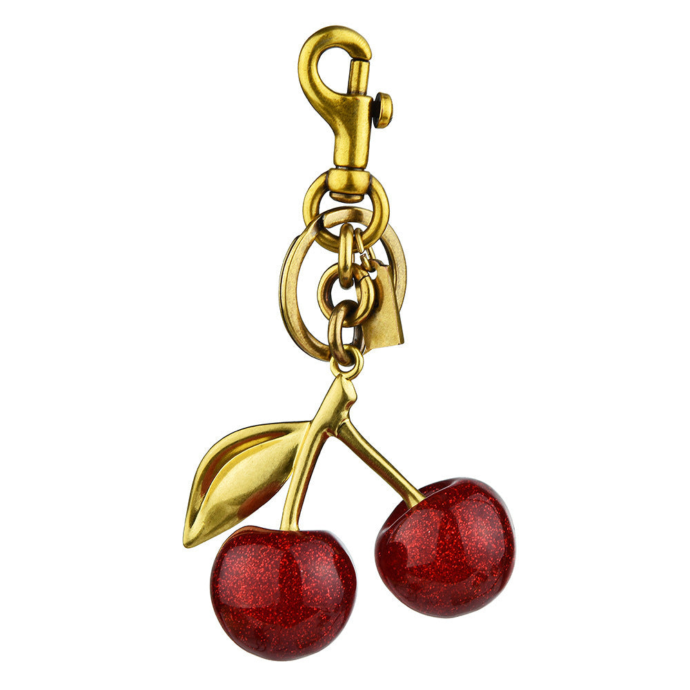 Red cherry-shaped keychain bag pendant accessory by eprolo, featuring an exquisite and classic cherry button charm.