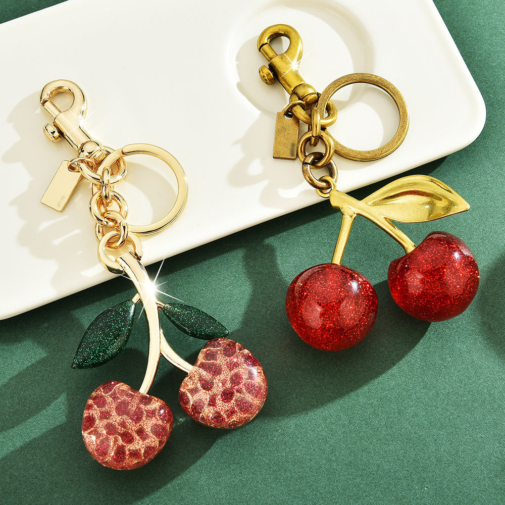 Red cherry-shaped keychain bag pendant accessory by eprolo, featuring an exquisite cherry charm with a classic design.
