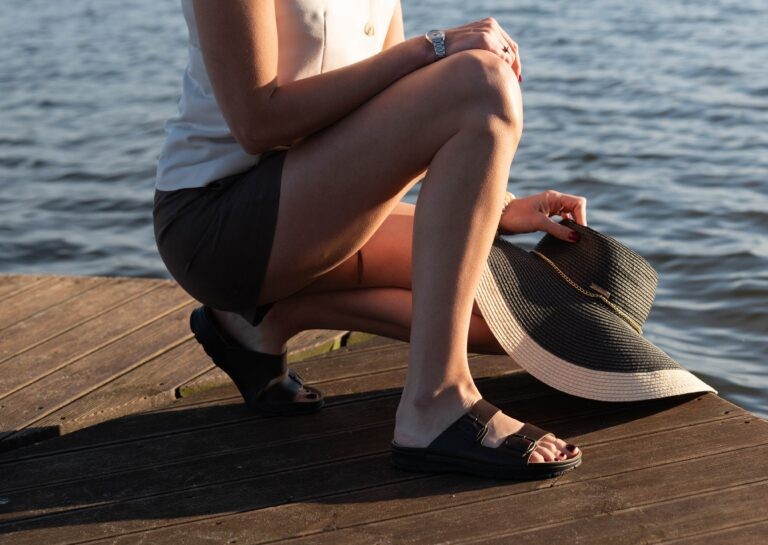 Dark brown Meeliku leather sandals by Omaking, featuring open-toe design and ankle straps, displayed on a neutral background.
