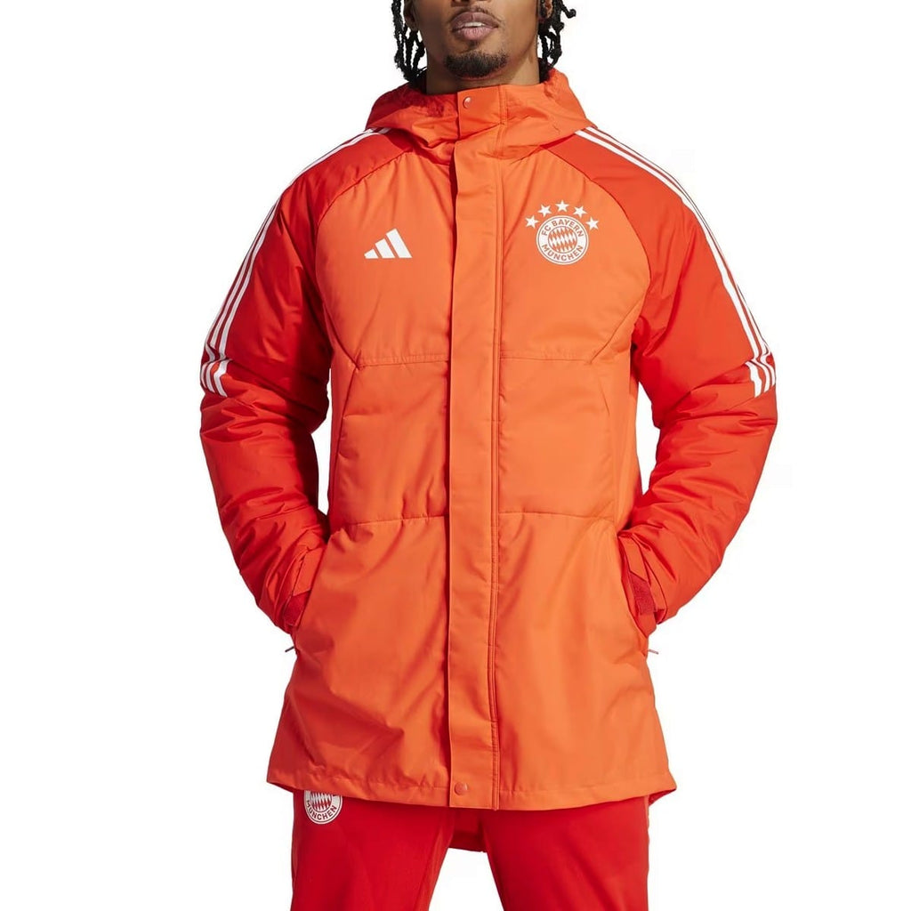 Light red Bayern Munich soccer down jacket with Adidas branding, featuring a hood and quilted design for adults.
