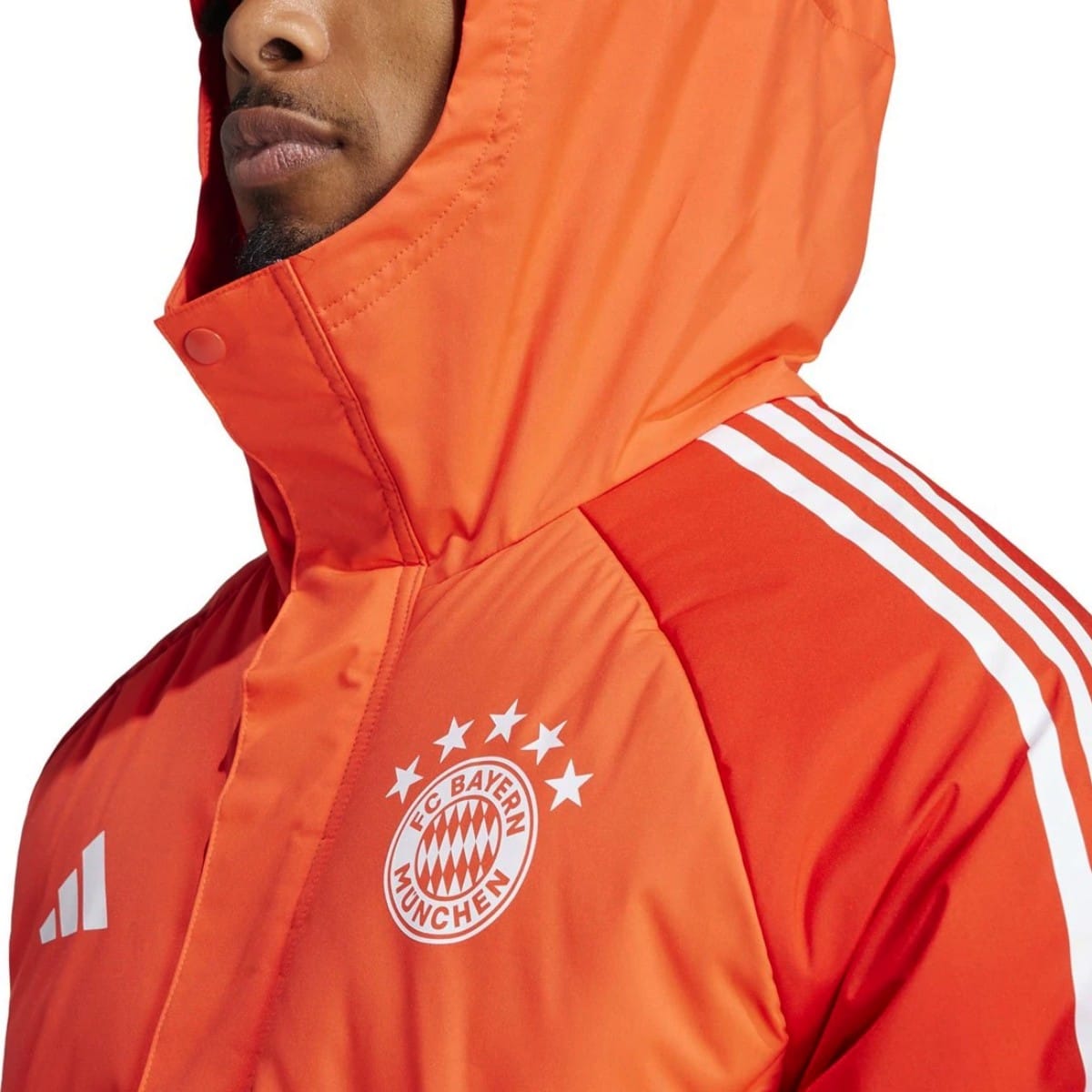 Light red Bayern Munich soccer down jacket for adults, 2024 Adidas parka with team logo and sporty design.