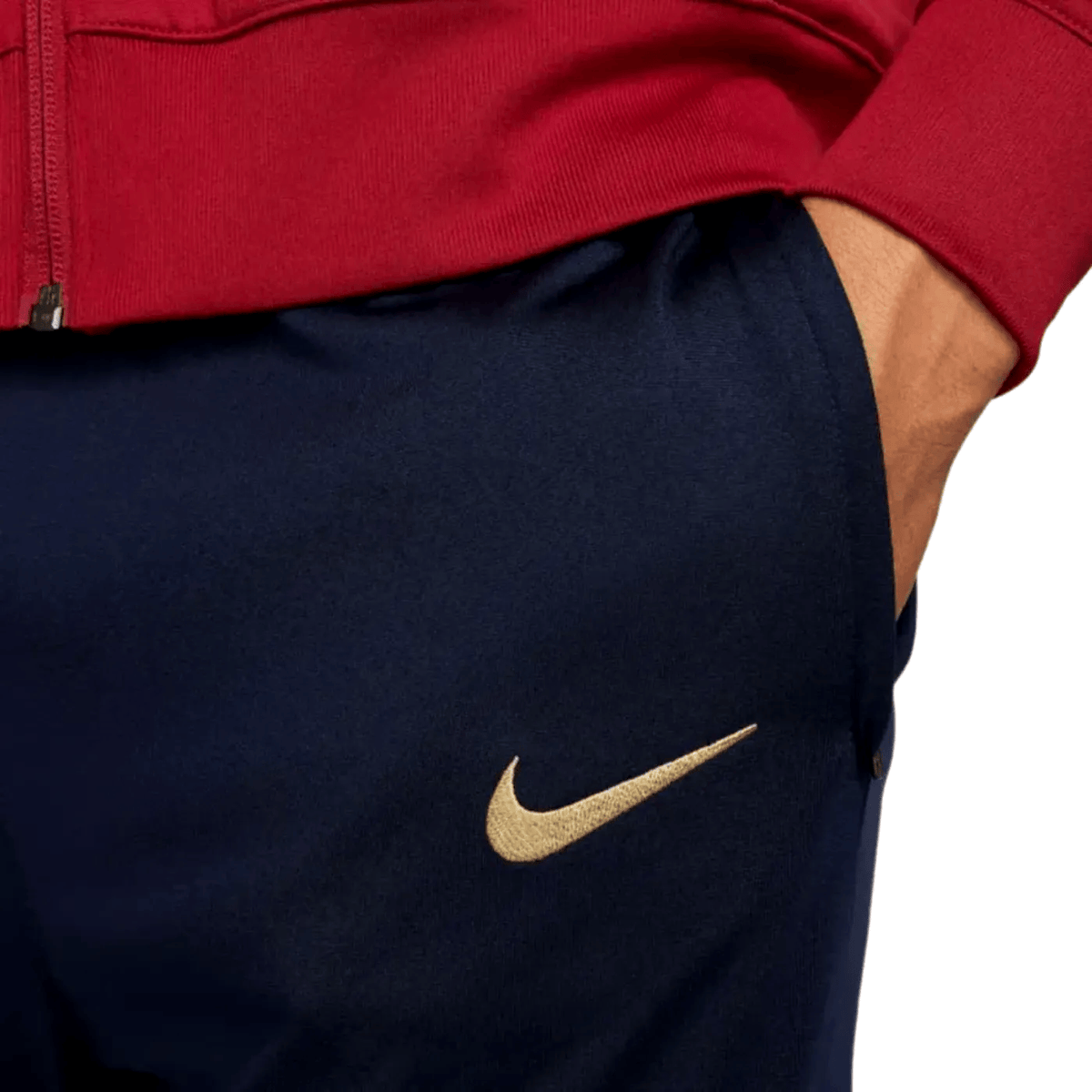 Red and blue FC Barcelona training presentation tracksuit for 2024 by Nike, featuring the team's logo and athletic design.